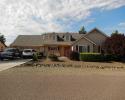 Go traditional with a classic style home that features a 2 car garage, lovely siding, and shutters. 